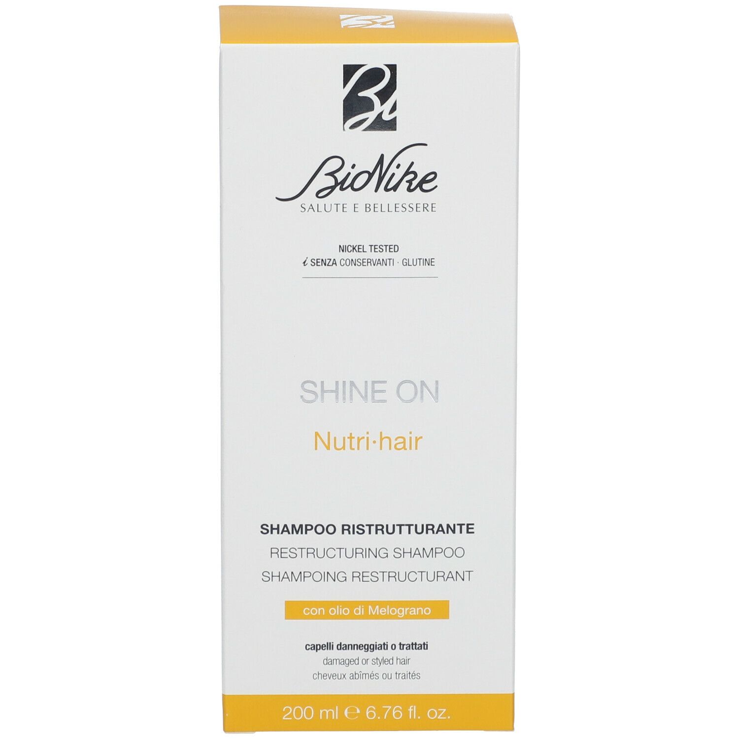 Doos met opschrift: Bionike, Shine On, Nutri-hair, Shampoo Ristrutturante. Volume: 200 ml.