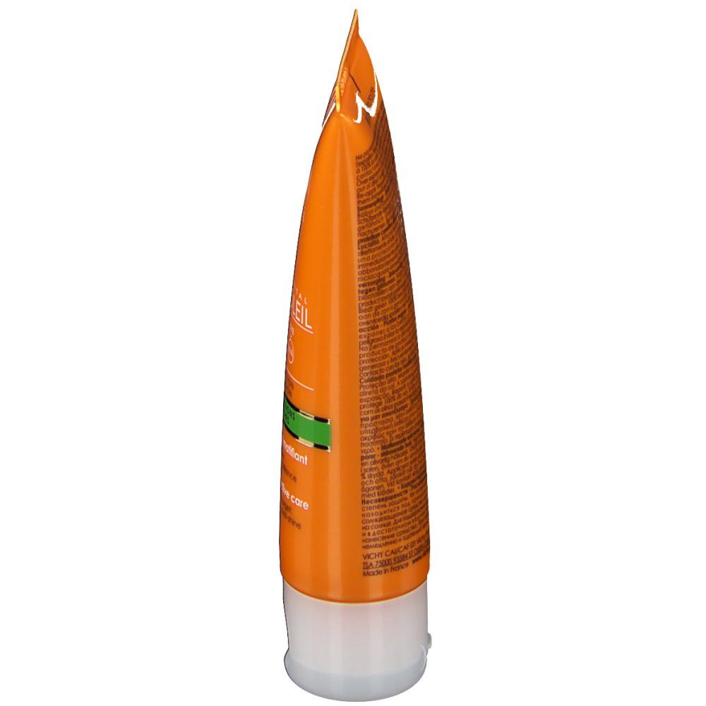 Tube orange. Texte: Ideal Soleil, SPF 30, Anti-imperfections. Bouchon blanc. Accents verts.