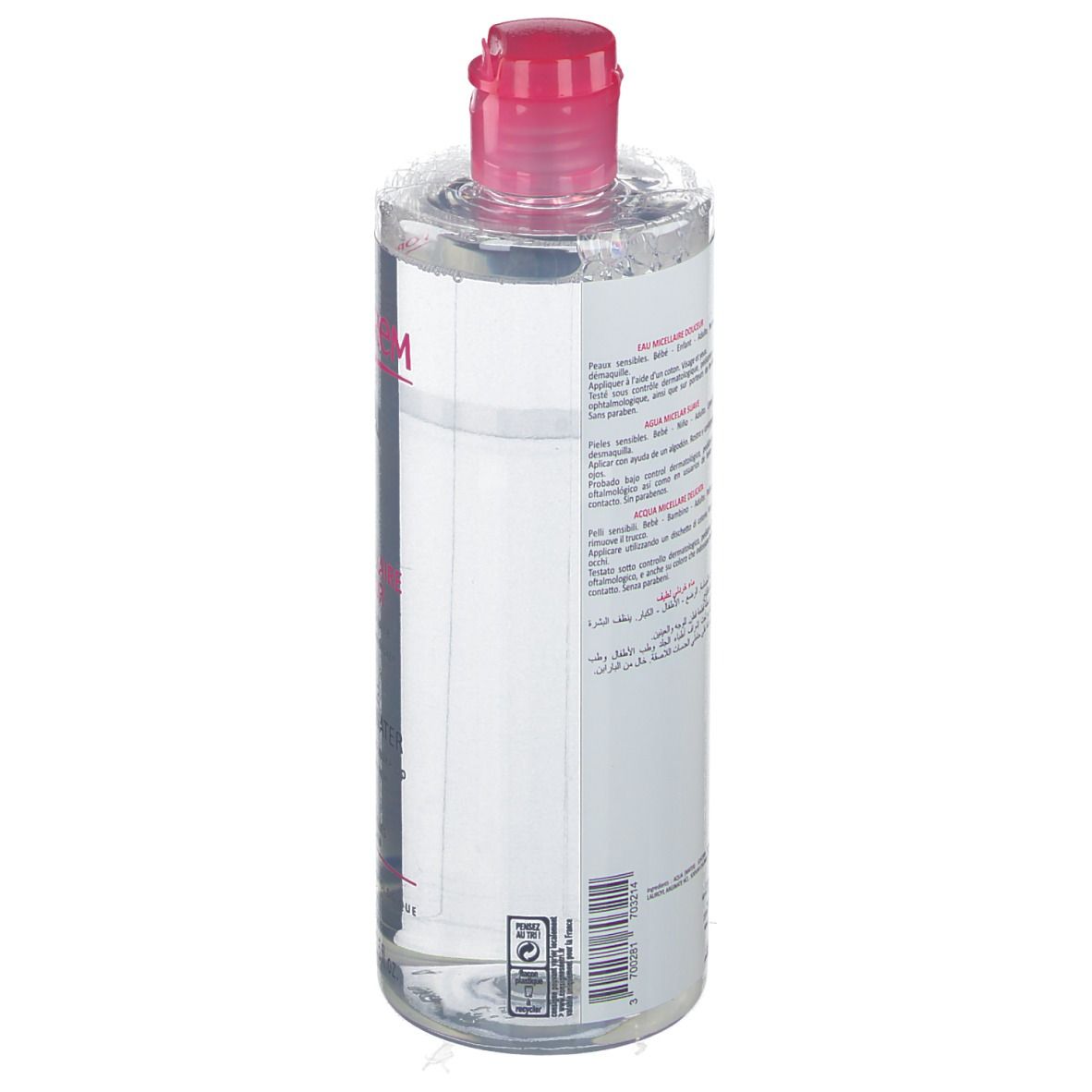 Flacon transparent, bouchon rose. Étiquette avec texte multilingue. Produit pour peaux sensibles.