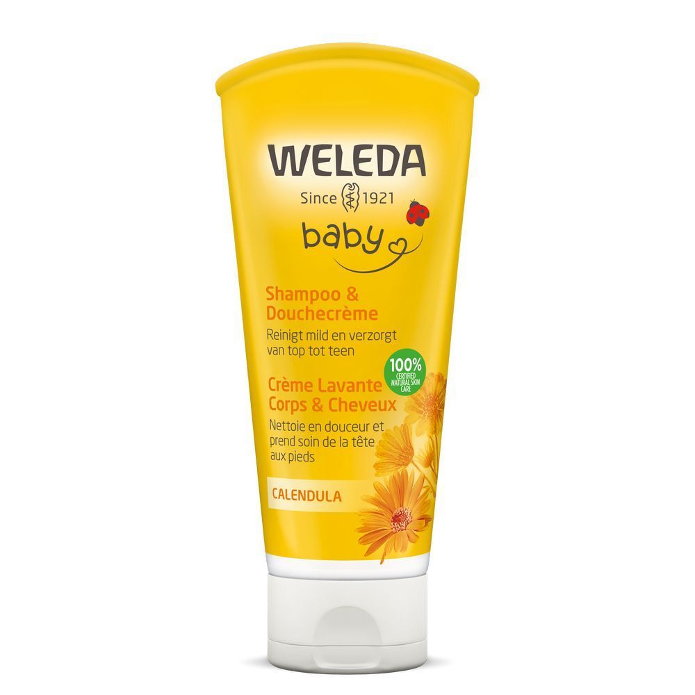 Gele tube "Weleda Baby" met tekst "Shampoo & Duschcreme". Illustratie van calendulabloemen. 100% natuurlijke ingrediënten.