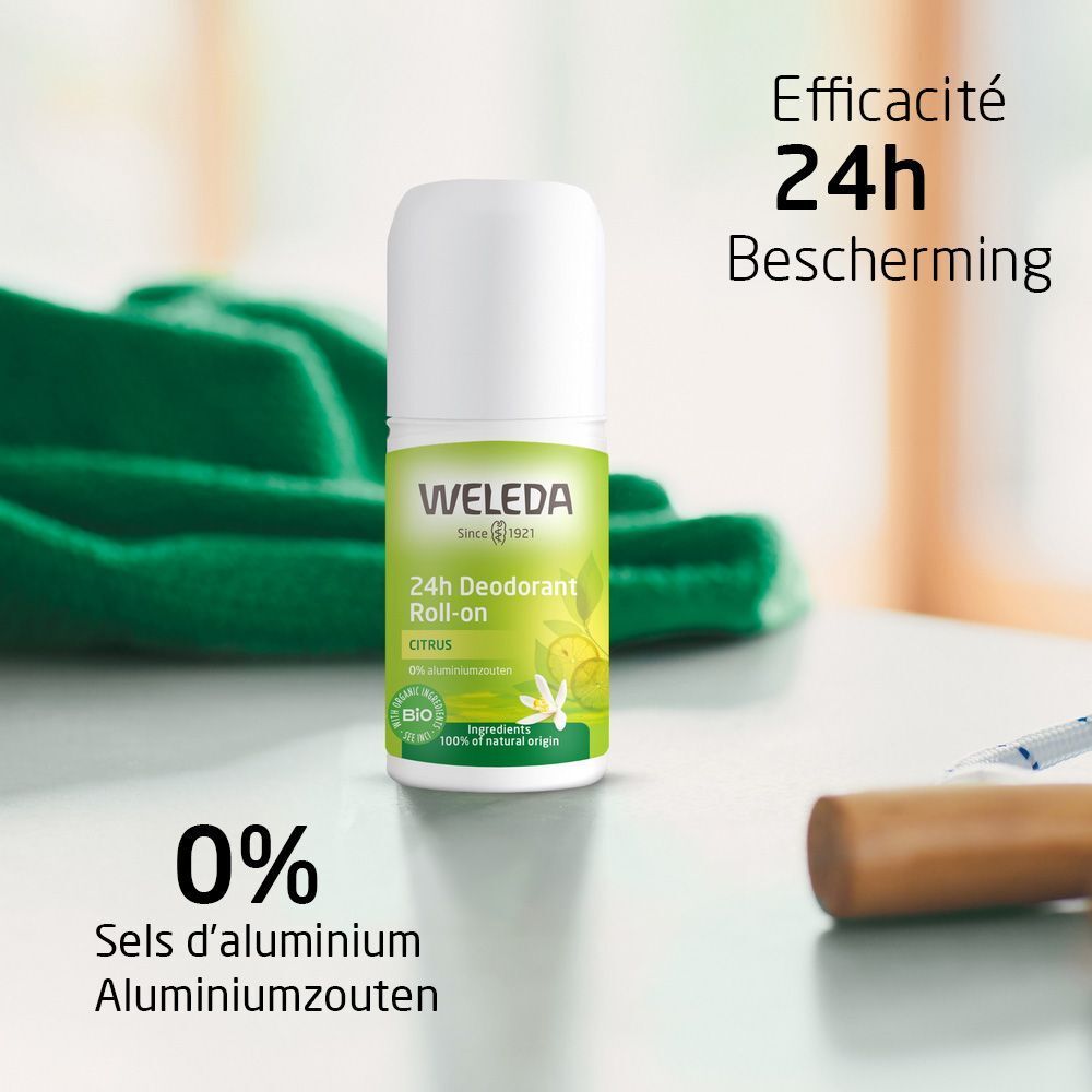 Roll-on déodorant Weleda Citrus. Sur table, texte: Efficacité 24h, 0% sels d'aluminium. Produit vert et blanc.