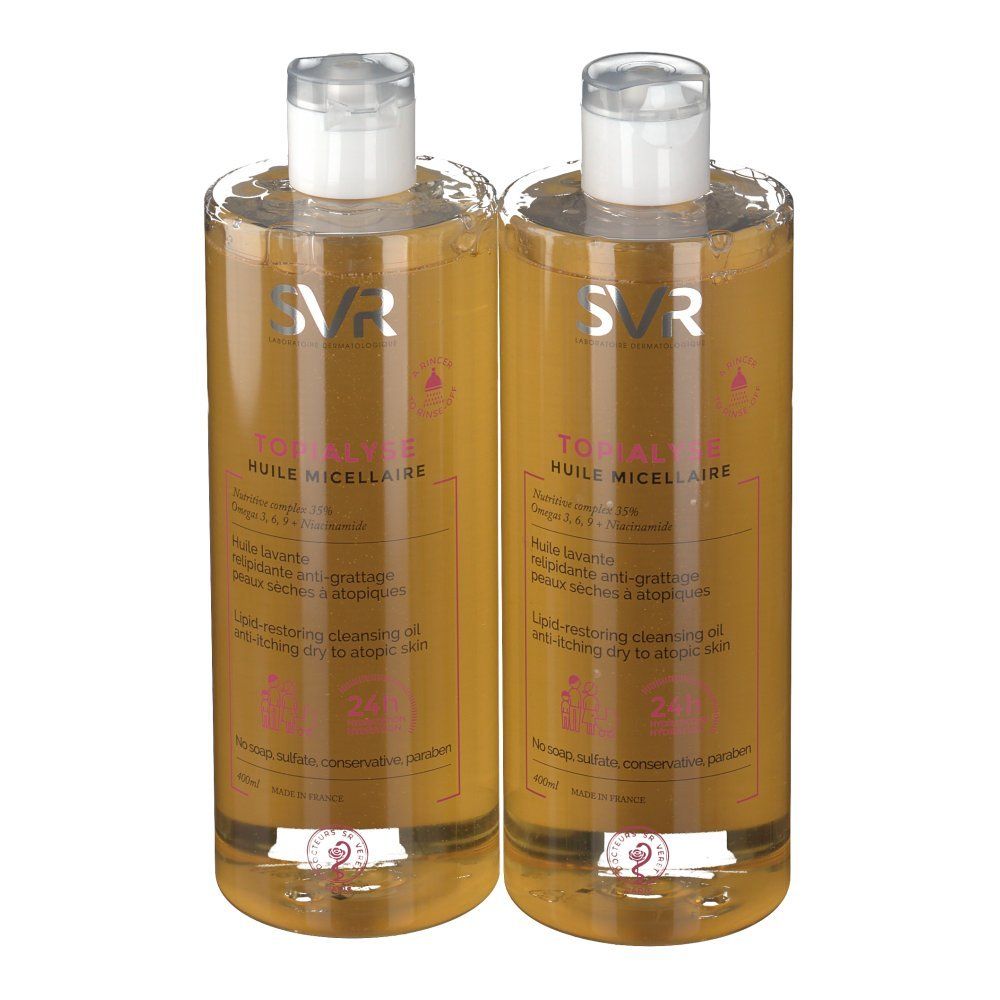 Deux flacons de SVR Topialyse Huile Micellaire. Liquide clair, bouchon blanc, étiquette rose. Inscription: Huile Micellaire.