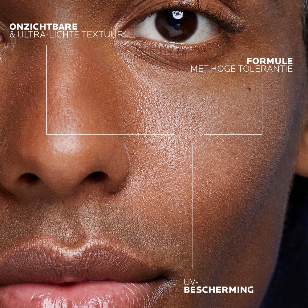 La Roche-Posay Anthelios gezichtsspray. Witte spuitfles met oranje etiket. SPF 50+.