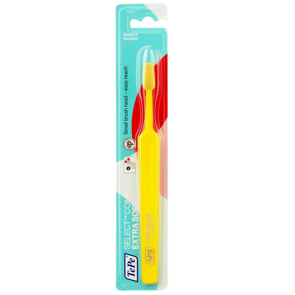 Brosse à dents jaune en emballage blister. Manche avec texte. Petite tête de brosse. "EXTRA SOFT" et "easy reach" sur l'emballage.
