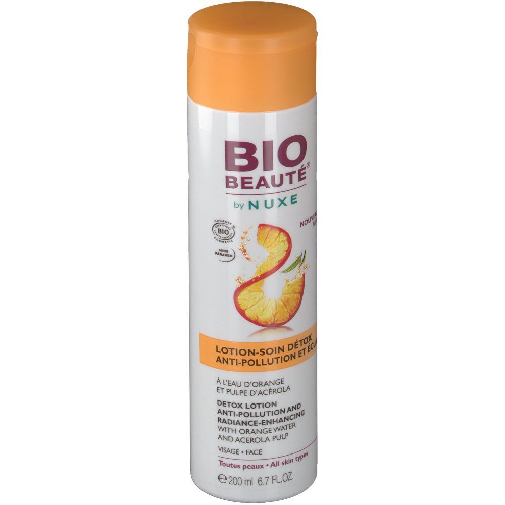 Flacon blanc avec bouchon orange. Inscription: BIO BEAUTÉ by NUXE. Lotion-soin détox. À l'eau d'orange et pulpe d'acérola.