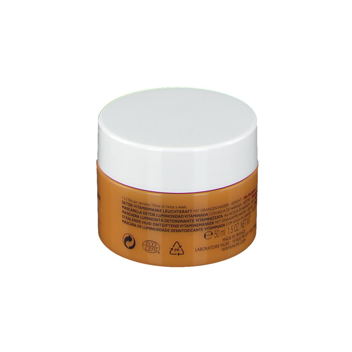 Pot rond, couvercle blanc. Contenant orange avec texte. Texte: Masque détox éclat vitaminé. 50ml. Tous types de peaux.