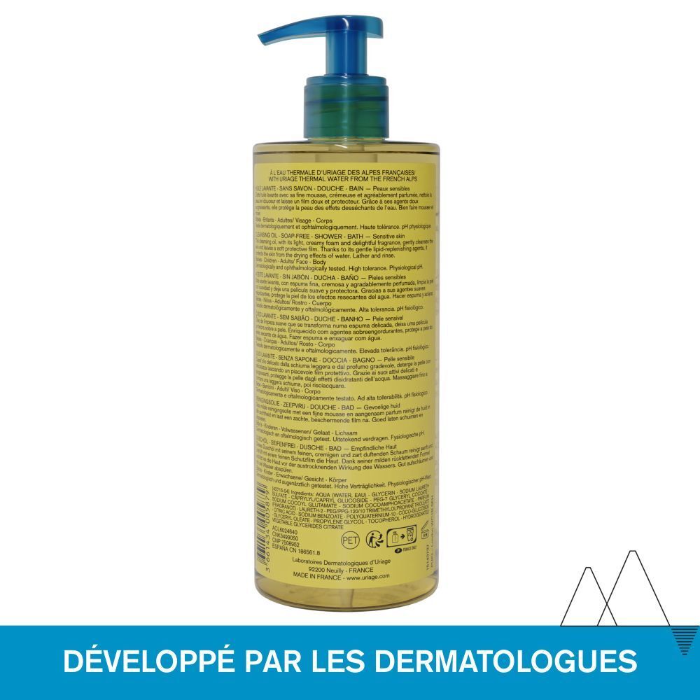 Dos du flacon d'Huile Lavante Uriage. Informations produit sur l'étiquette. Texte bleu et blanc, liquide transparent.