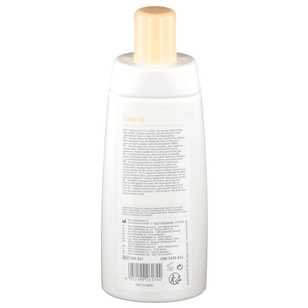 Rückseite der weißen Flasche mit Text. Enthält Informationen zu Inhaltsstoffen, Hersteller und Chargennummer. Der Verschluss ist beige.