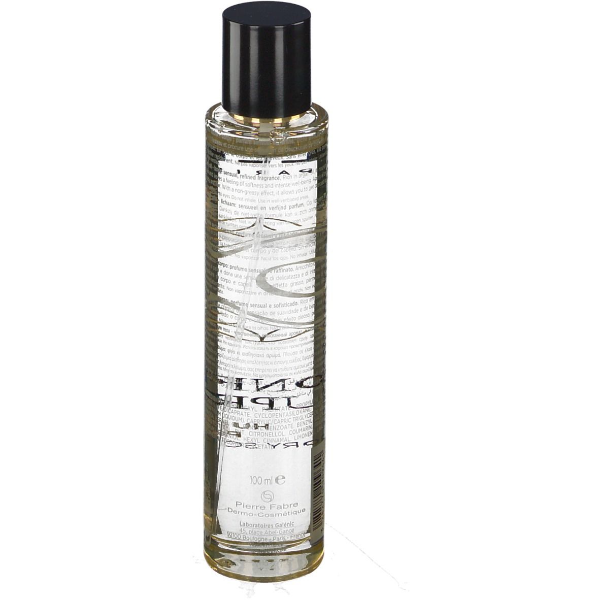 Huile sèche parfumée Galénic. Flacon transparent, bouchon noir. Inscriptions et motifs dorés.