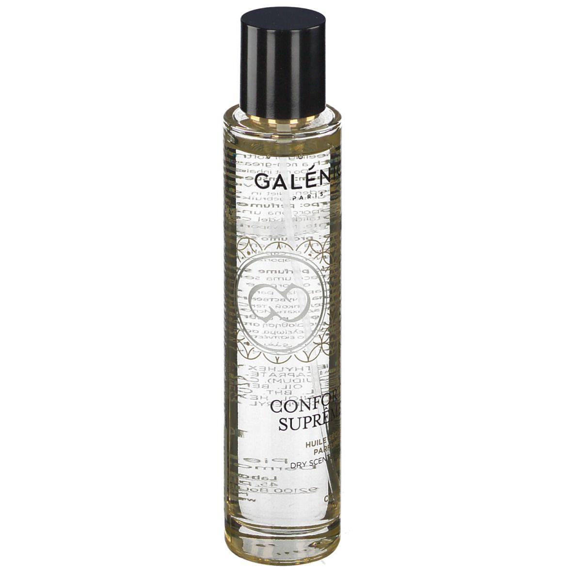 Huile sèche parfumée Galénic. Flacon transparent, bouchon noir. Inscriptions et motifs dorés.
