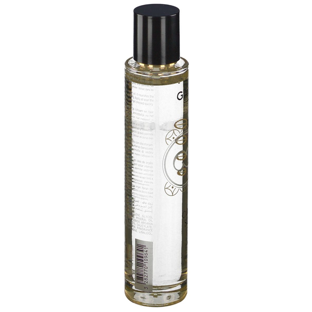 Huile sèche parfumée Galénic. Flacon transparent, bouchon noir. Inscriptions et motifs dorés.