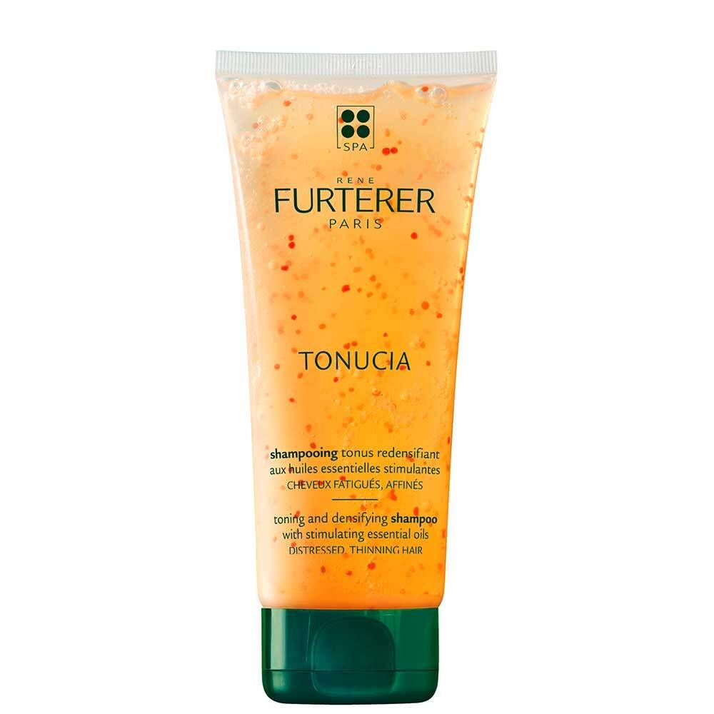 Shampoo transparent avec particules rouges. Inscription TONUCIA et RENE FURTERER PARIS. Bouchon vert.