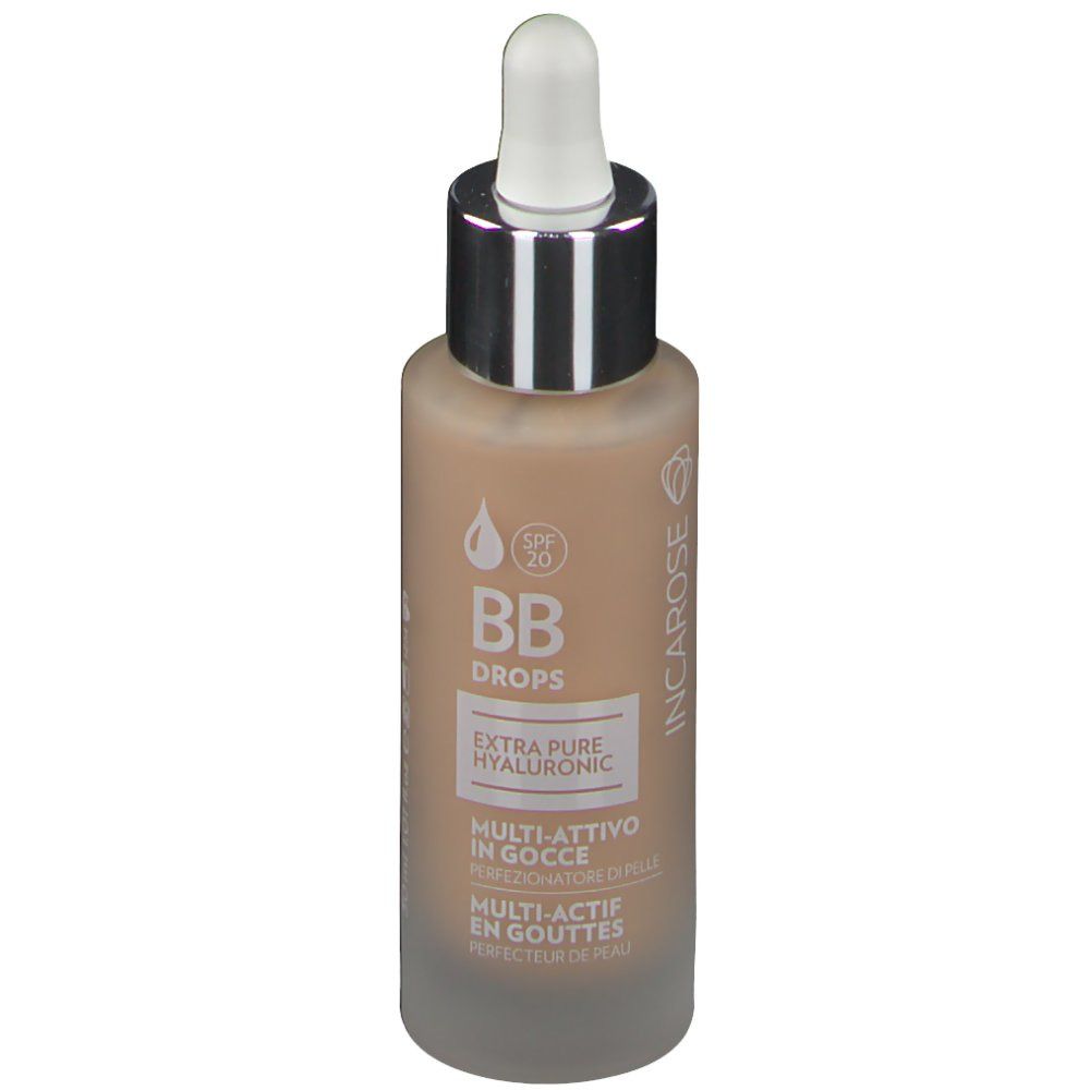 Flacon avec compte-gouttes. Inscription: BB Drops, Extra Pure Hyaluronic, Multi-Actif en gouttes. Avec SPF 20.