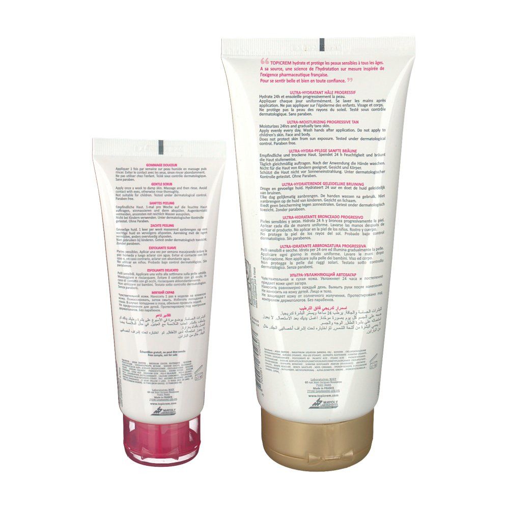 Achteraanzicht van twee tubes. Grote tube met gouden dop, kleine tube met roze dop. Tekst in meerdere talen.