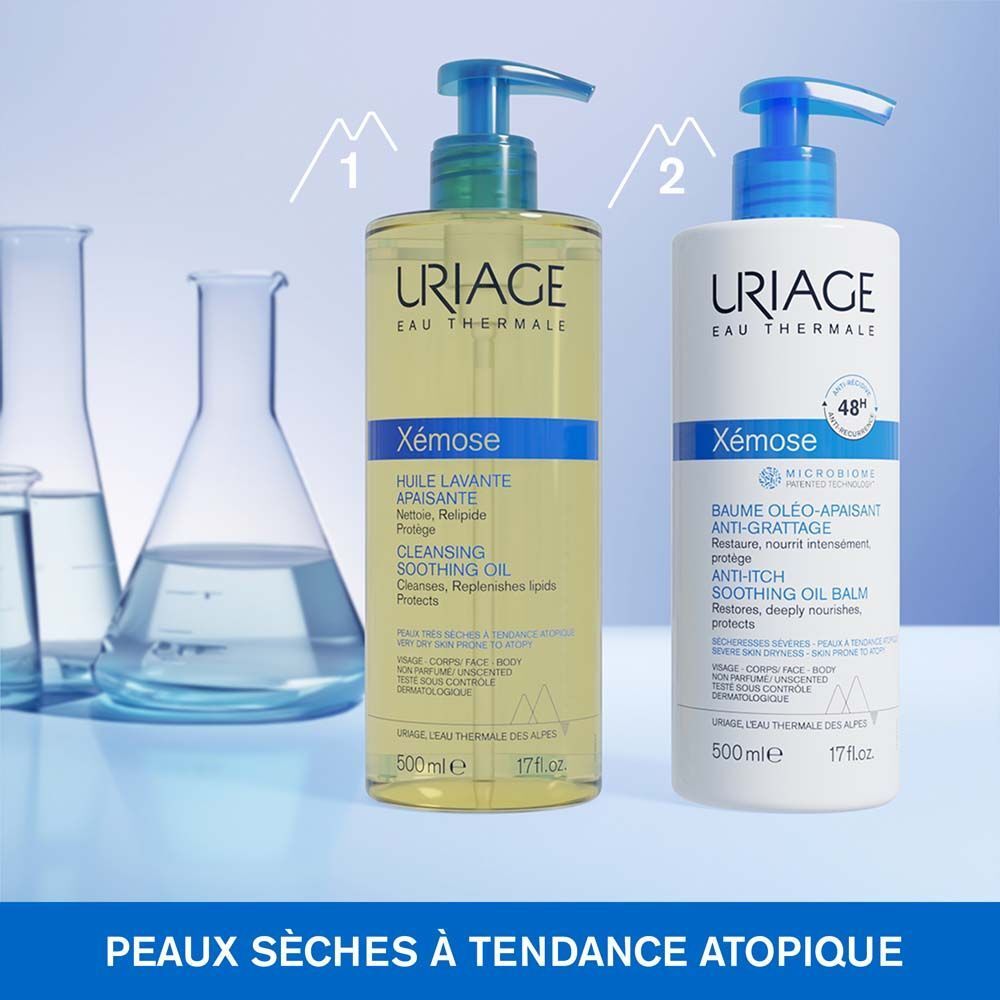 Flacon Uriage Xémose, huile lavante apaisante. Bouchon bleu. Texte: Cleansing Soothing Oil, 500ml.