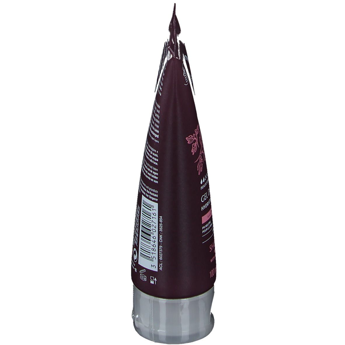 Haut du tube marron avec texte et illustration de figue. Fermeture transparente. Nom du produit et marque non visibles.