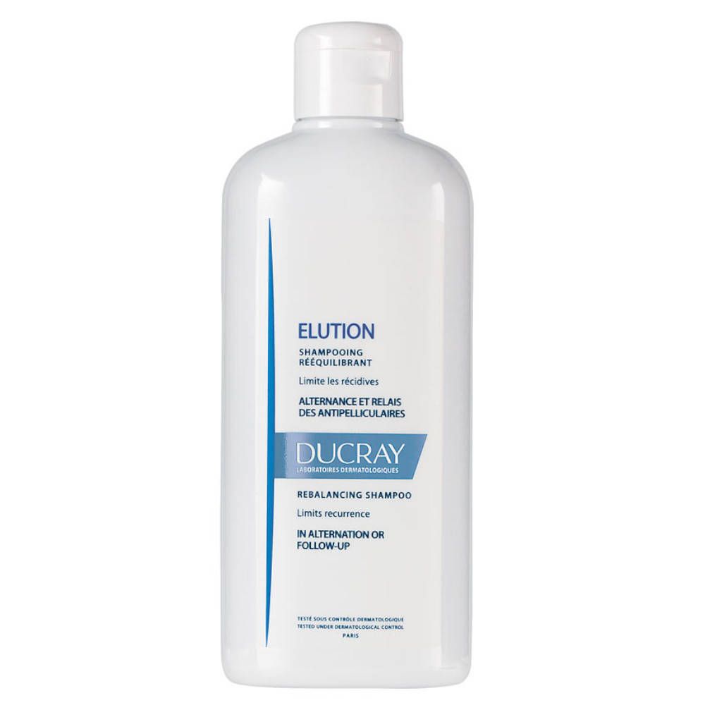 Flacon blanc avec étiquette bleue. Inscription : Elution, Ducray. Shampooing pour cuirs chevelus sensibles.