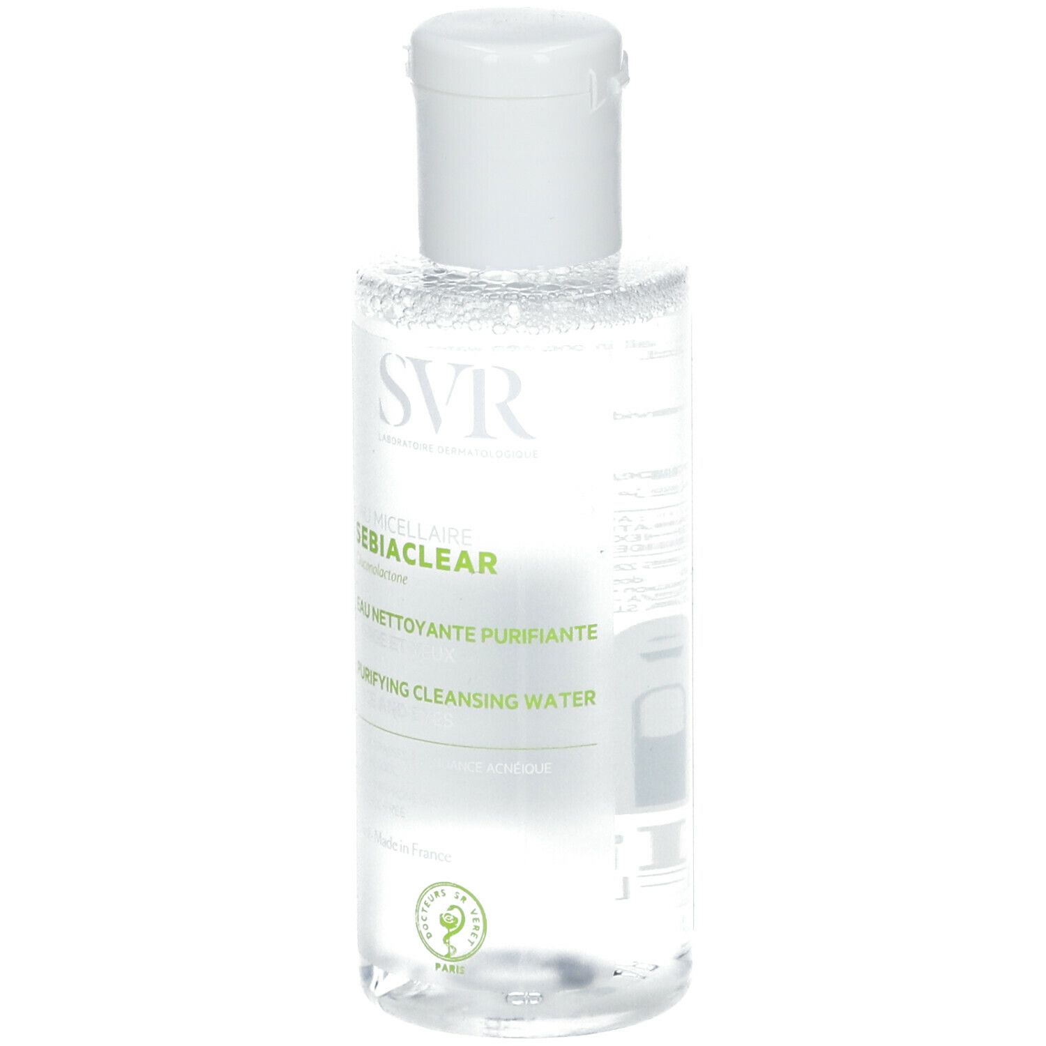 Flacon transparent avec bouchon blanc. Inscriptions: SVR SEBIACLEAR, Eau Micellaire, Eau Nettoyante Purifiante, Purifying Cleansing Water.