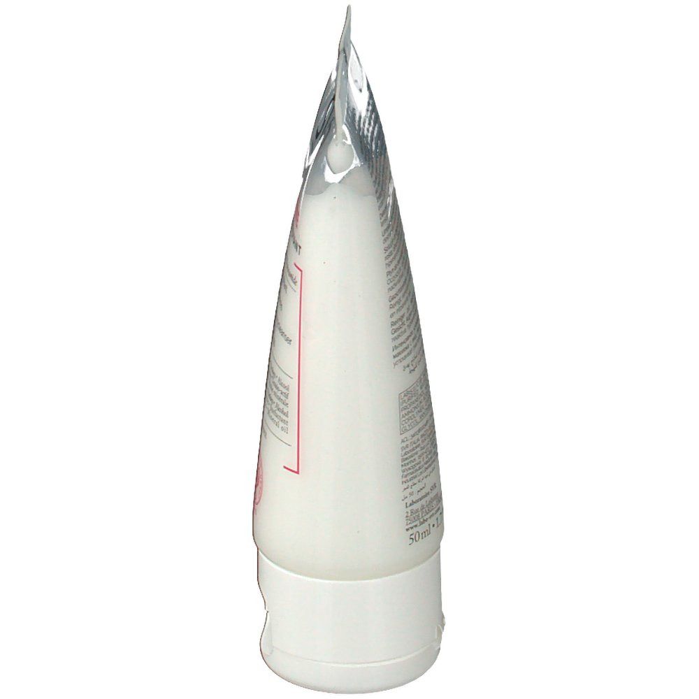 Vue latérale du tube blanc SVR Sensifine Dermo-Nettoyant. Le bouchon est blanc. Le tube est en plastique.