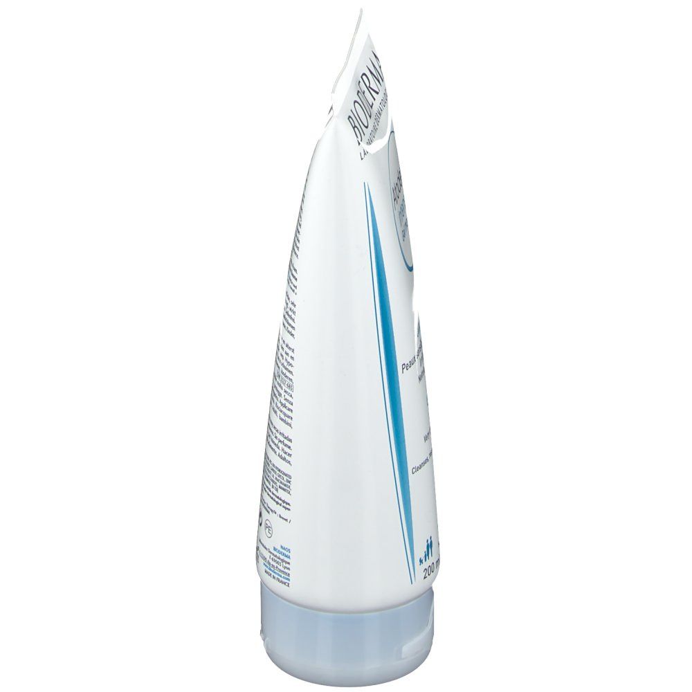 Witte tube, zijaanzicht. Blauwe strepen en tekst. Blauwe dop. Opschrift: BIODERMA, Atoderm Intensive Gel moussant.