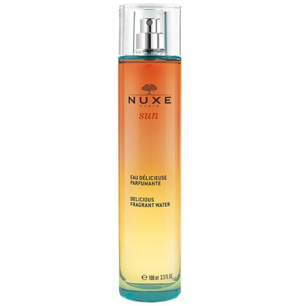 Flacon cylindrique avec vaporisateur. Dégradé de jaune à orange. Inscription: Nuxe Sun, Eau Délicieuse Parfumante, Delicious Fragrant Water.