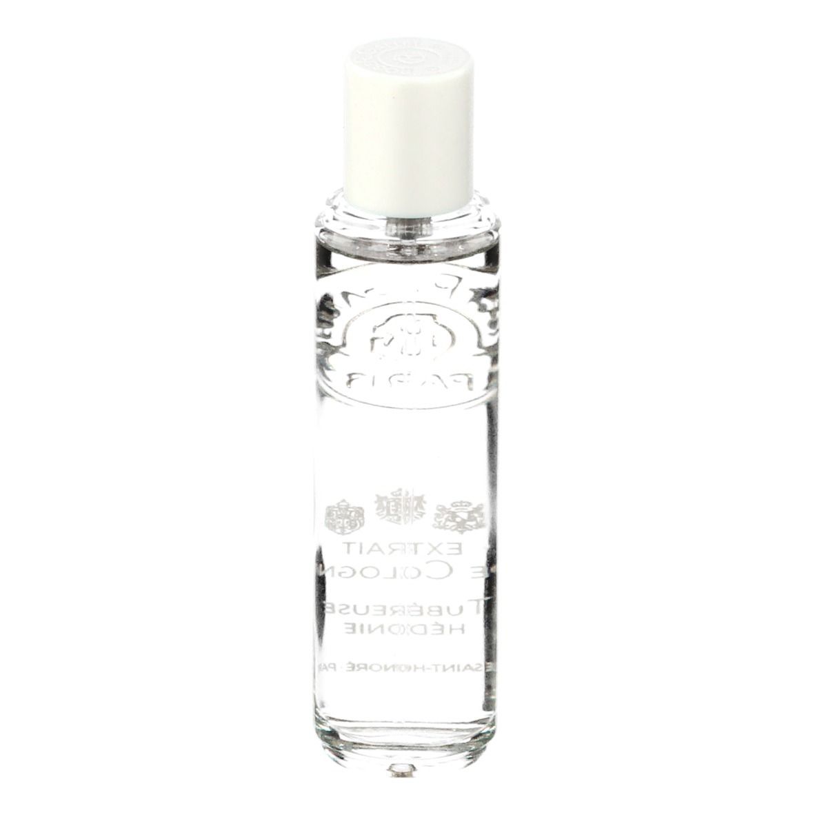 Flacon cylindrique avec bouchon blanc. Inscription: Extrait de Cologne, Tubéreuse Hédonie. Liquide clair.