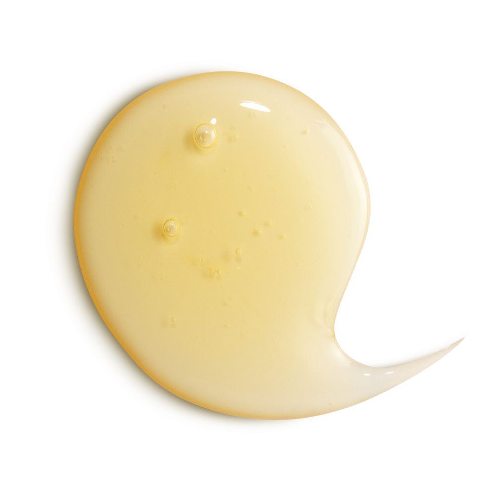 Geel, transparant shampoo monster. Druppelvormig met uitloop. Op witte achtergrond.