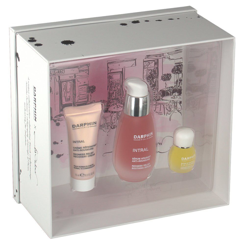 Coffret cadeau avec trois produits dans une boîte blanche. Produits visibles à travers un couvercle transparent.
