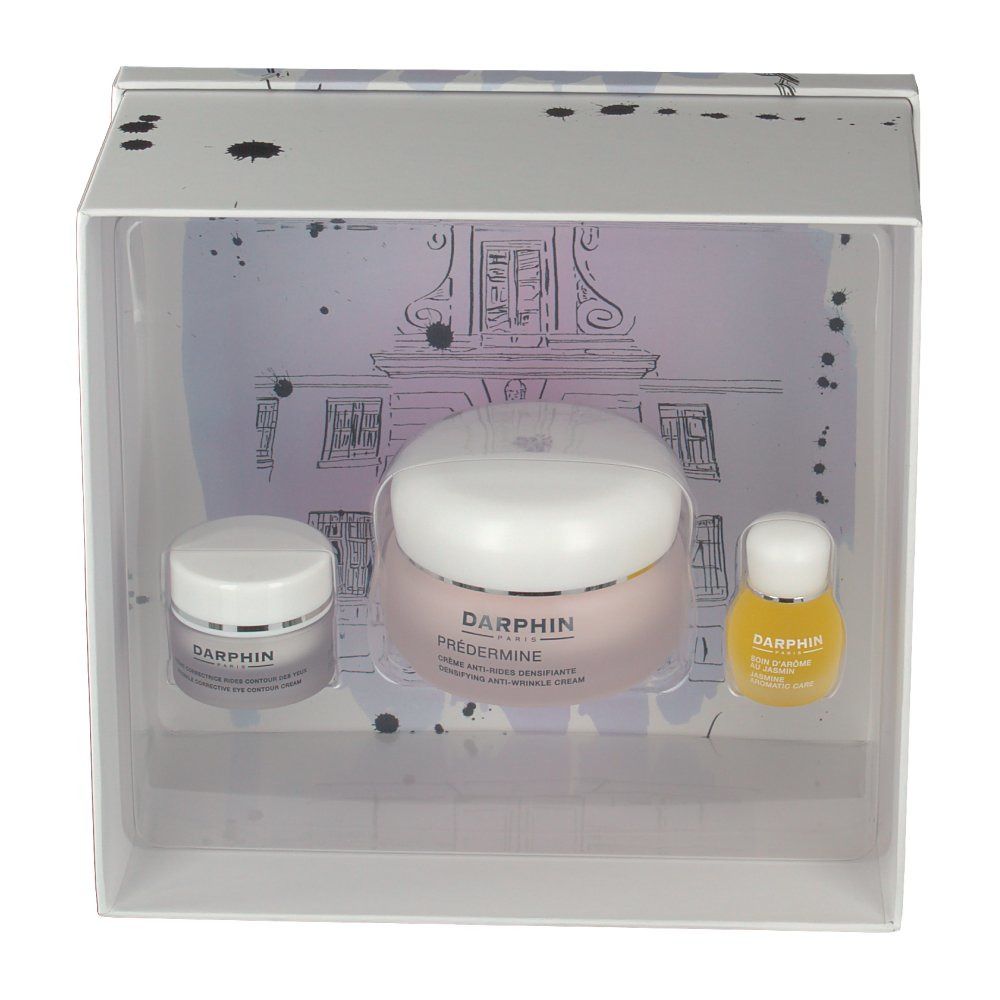 Coffret cadeau blanc contenant trois produits de soin. Crèmes et huile visibles. Logo Darphin présent.