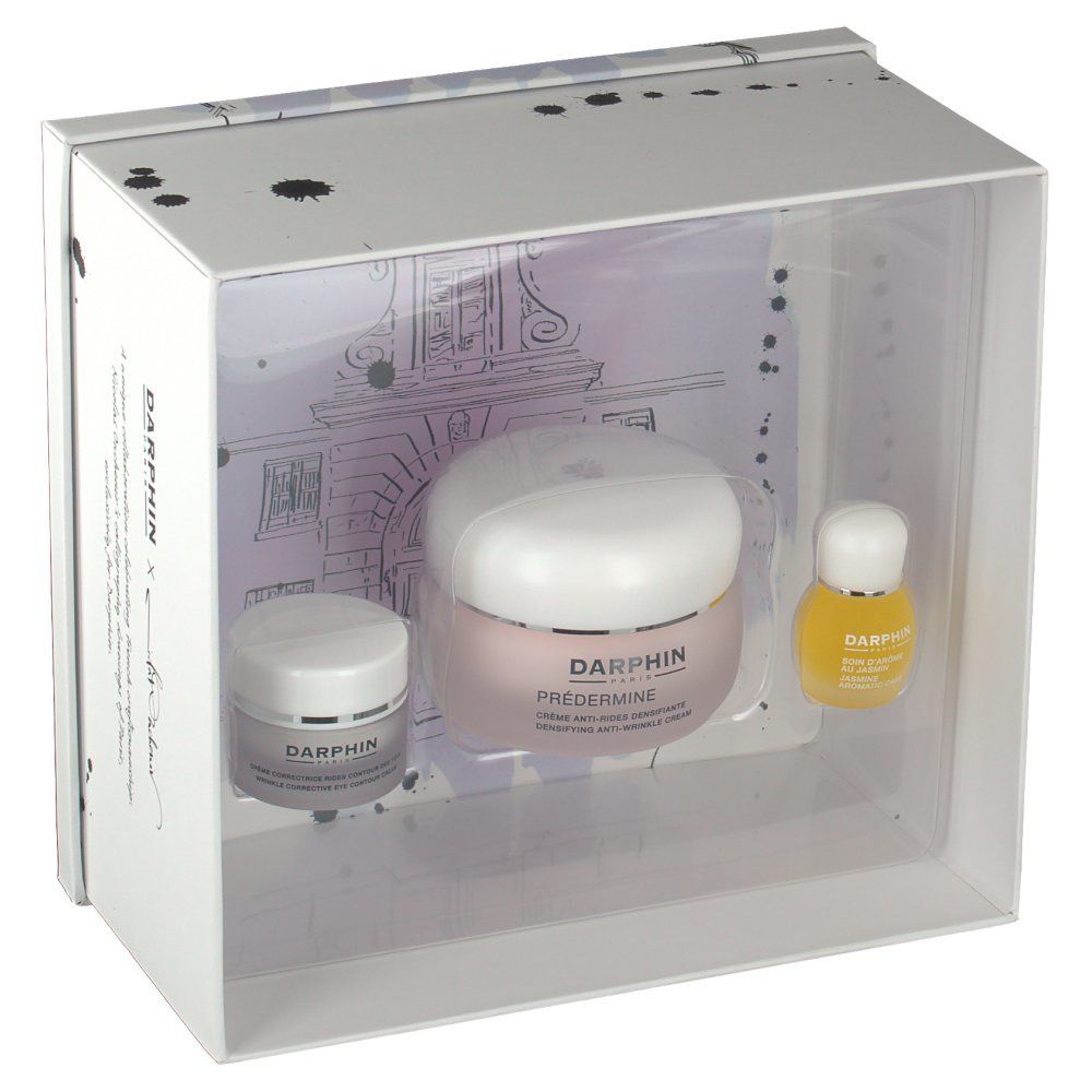 Coffret cadeau blanc avec trois produits. Crèmes et huile visibles. Logo Darphin présent.