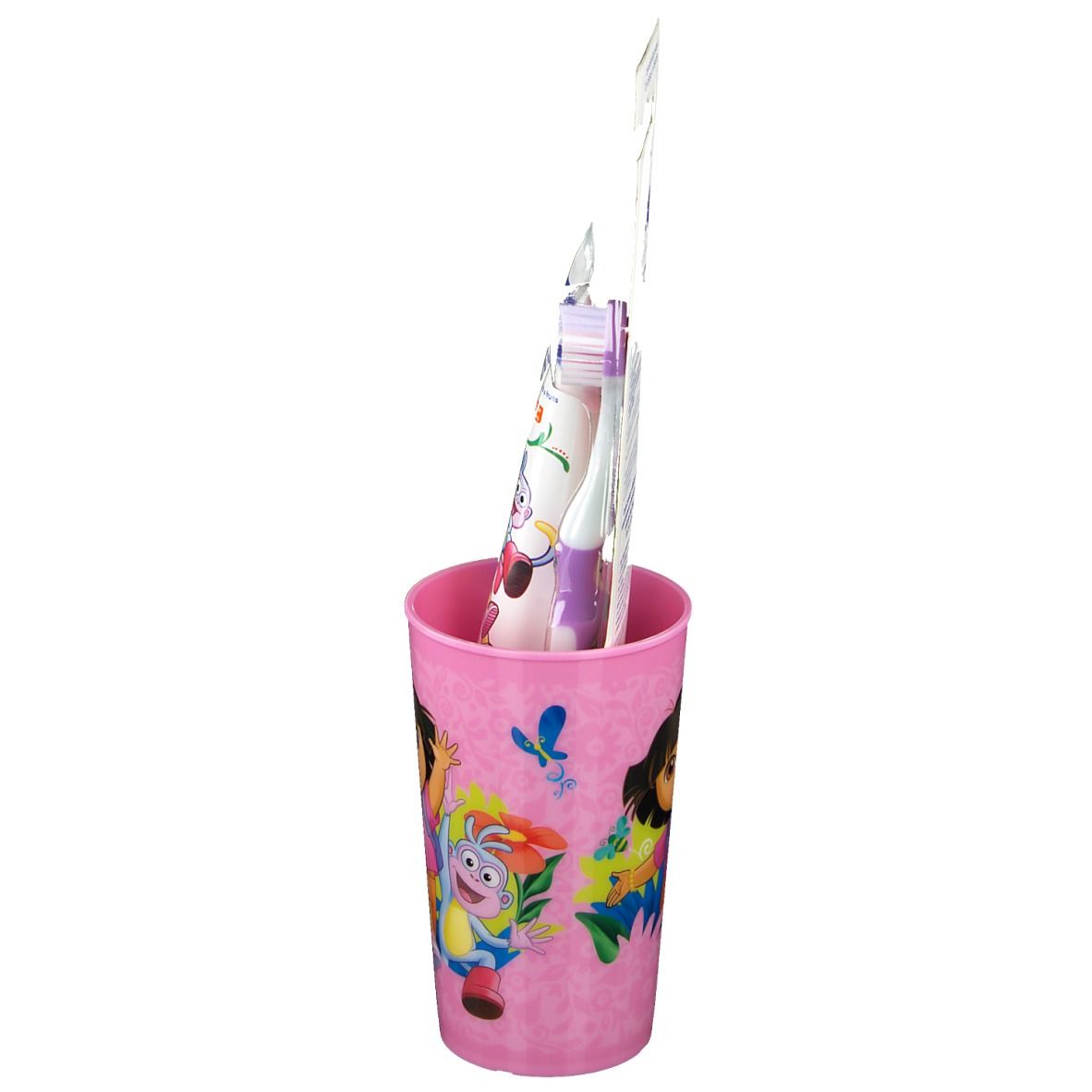 Roze Dora-beker, tandenborstel en tandpasta. Tandenborstel en tandpasta verpakt.