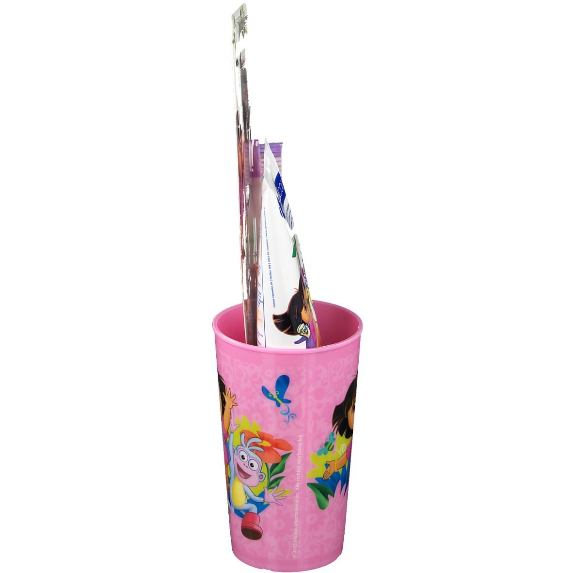 Roze Dora-beker, tandenborstel en tandpasta. Tandenborstel en tandpasta verpakt.