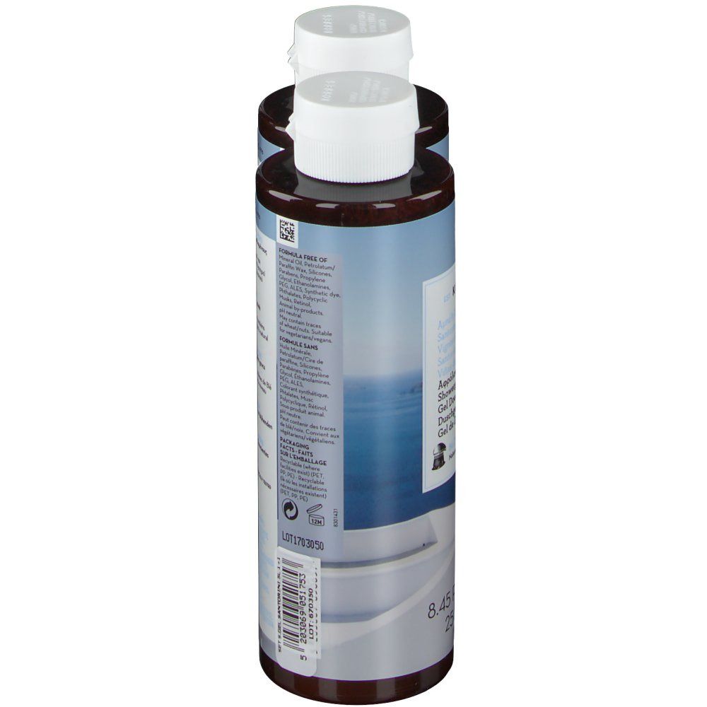 Deux flacons de gel douche, vue latérale arrière. Bouchons blancs, corps marron, étiquettes.