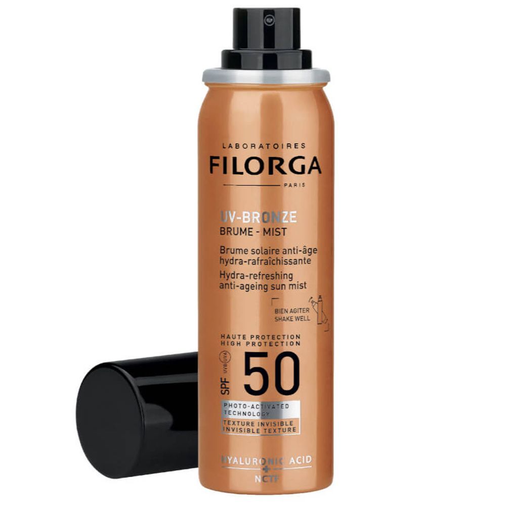 Filorga UV-Bronze Brume-Mist. Flacon doré avec bouchon noir. Informations produit et SPF 50 visibles.