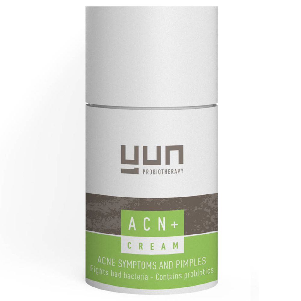 Weiße Tube mit grünem und braunem Band. Aufschrift: YUN, ACN+ Cream. Text: Akne-Symptome und Pickel. Enthält Probiotika.