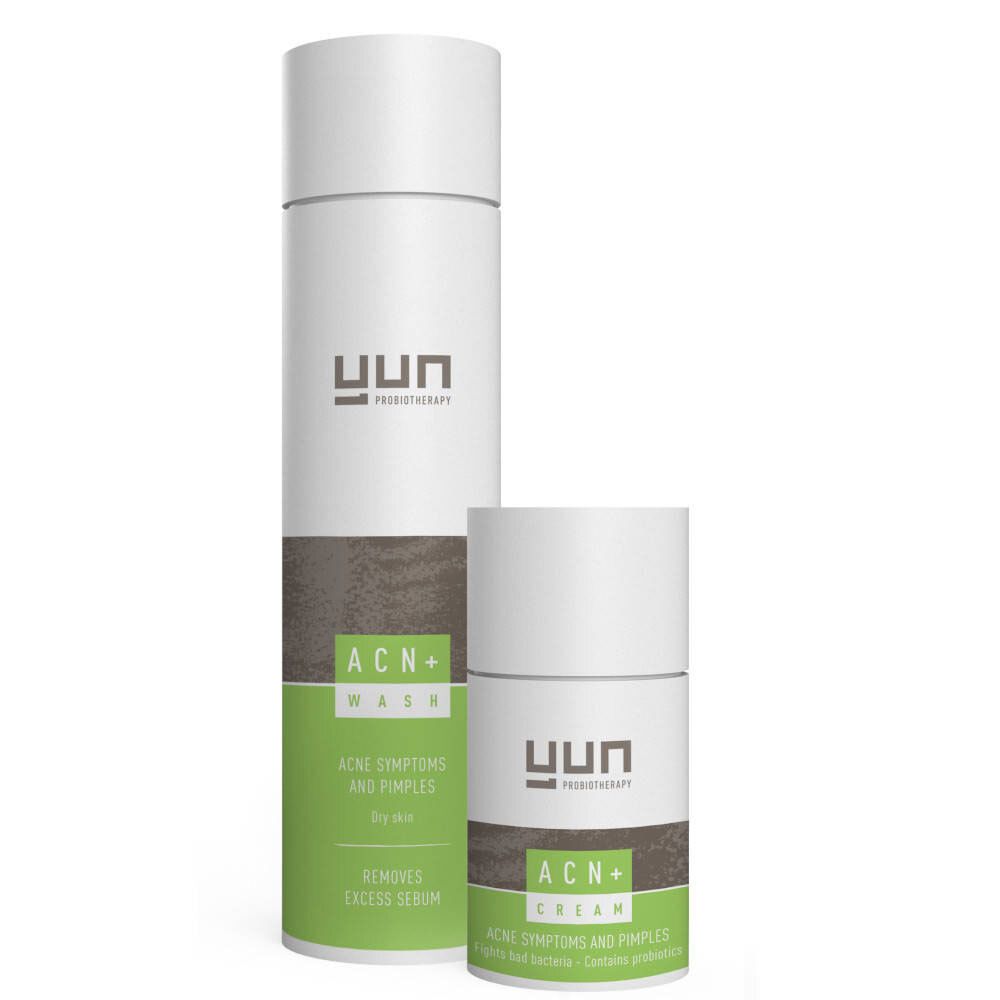 Twee witte flessen met groene en bruine accenten. Opschrift: YUN ACN+ Therapie. Voor acne-symptomen en puistjes.