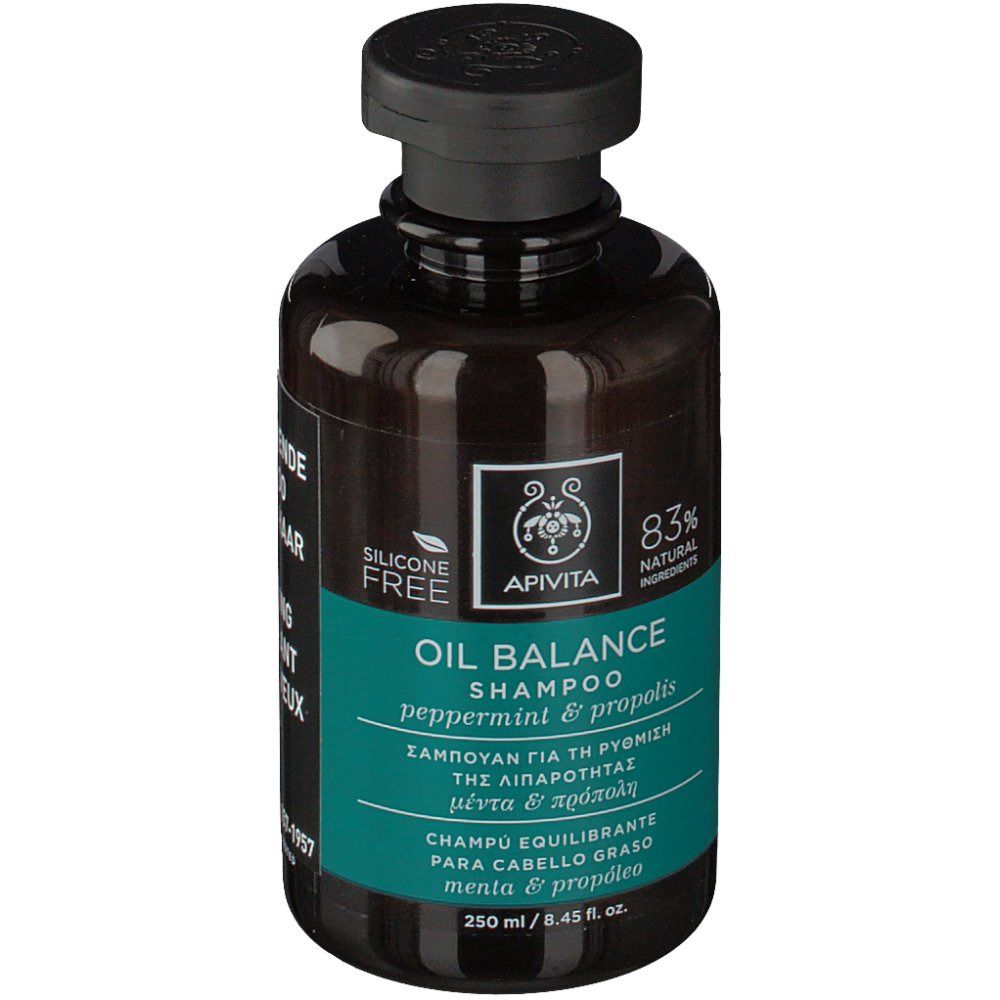 Donkerbruine fles met zwarte dop. Opschrift: Apivita Oil Balance Shampoo. Tekst in het Engels, Grieks, Frans. 250 ml.