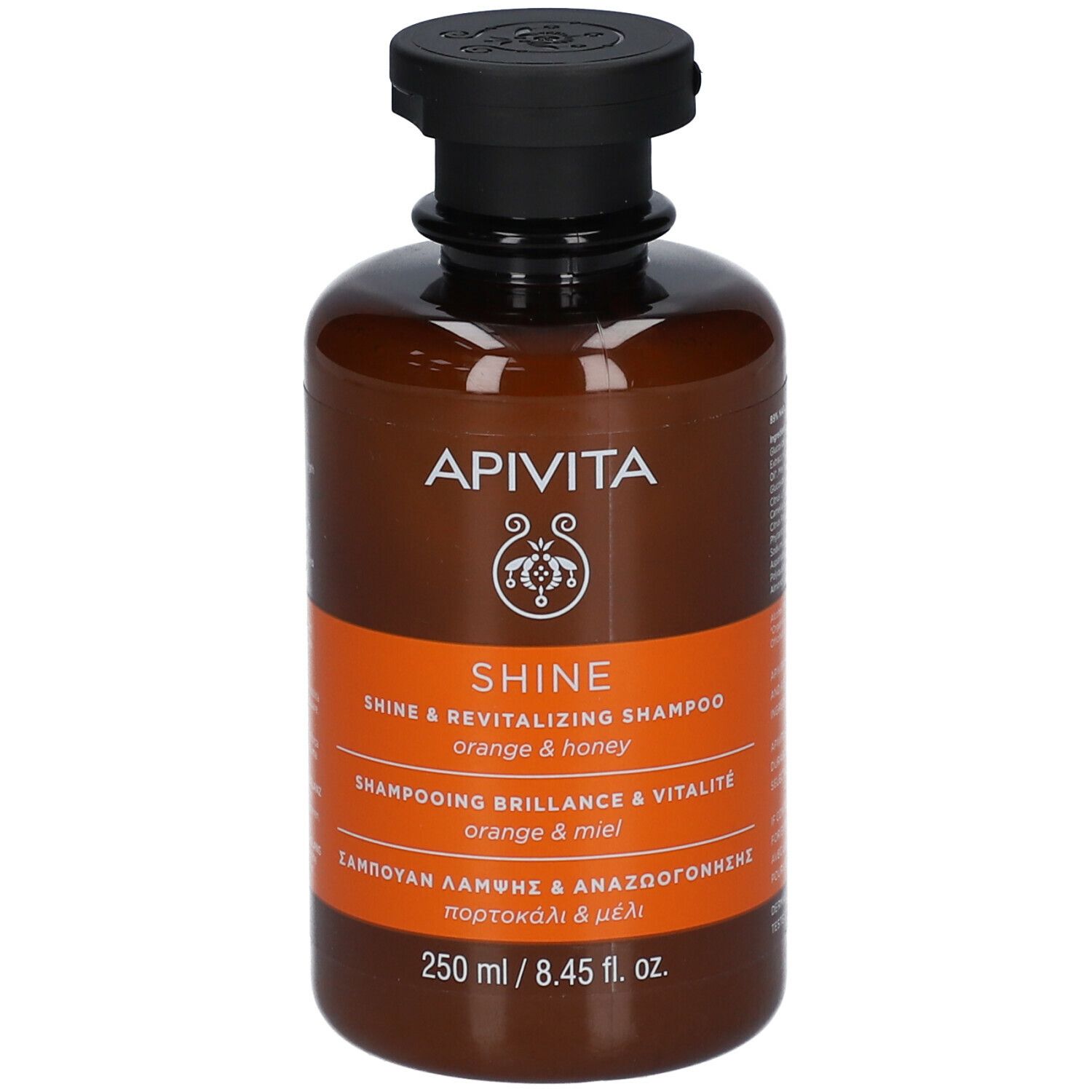Braune Flasche Shampoo. Schwarzer Deckel. Aufschrift: APIVITA SHINE. Orange & Honig. 250 ml.