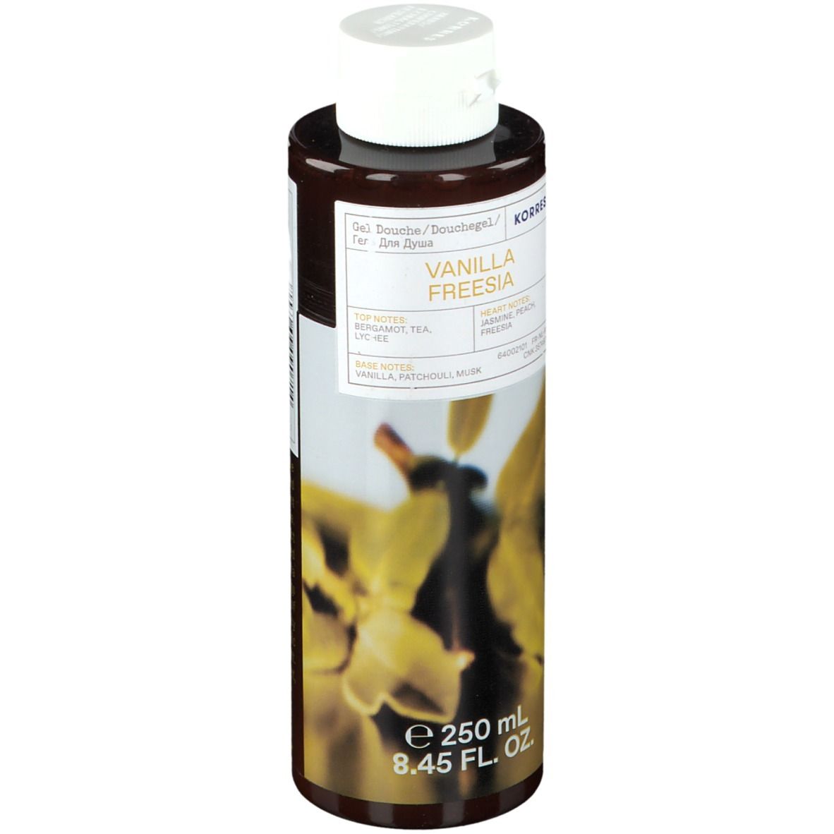 Flacon marron avec bouchon blanc. Inscription : Korres Vanilla Freesia. Étiquette avec motif floral et informations produit.