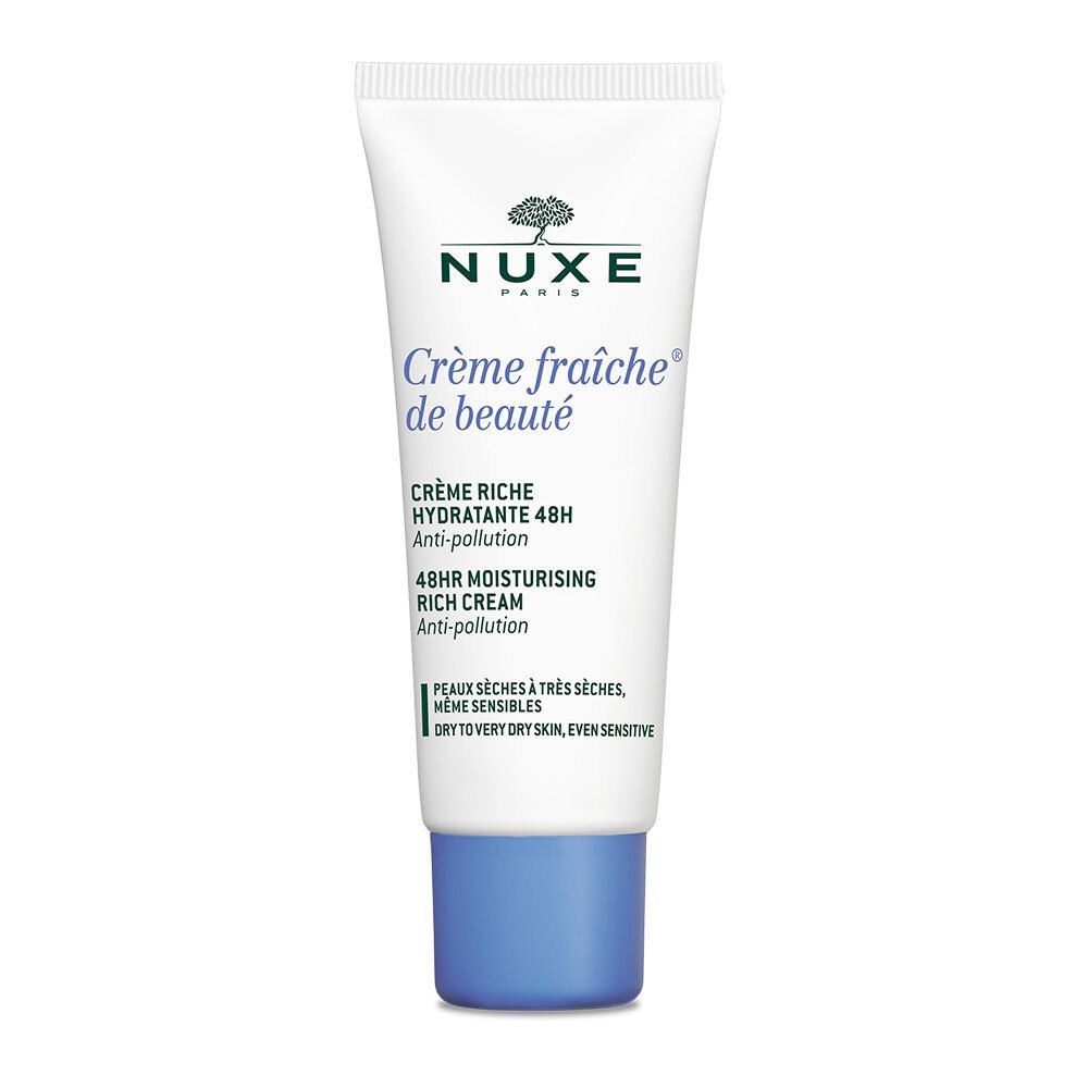 Tube blanc avec bouchon bleu. Inscription: Nuxe, Crème fraîche de beauté, Crème riche hydratante 48h, 48hr moisturizing rich cream.