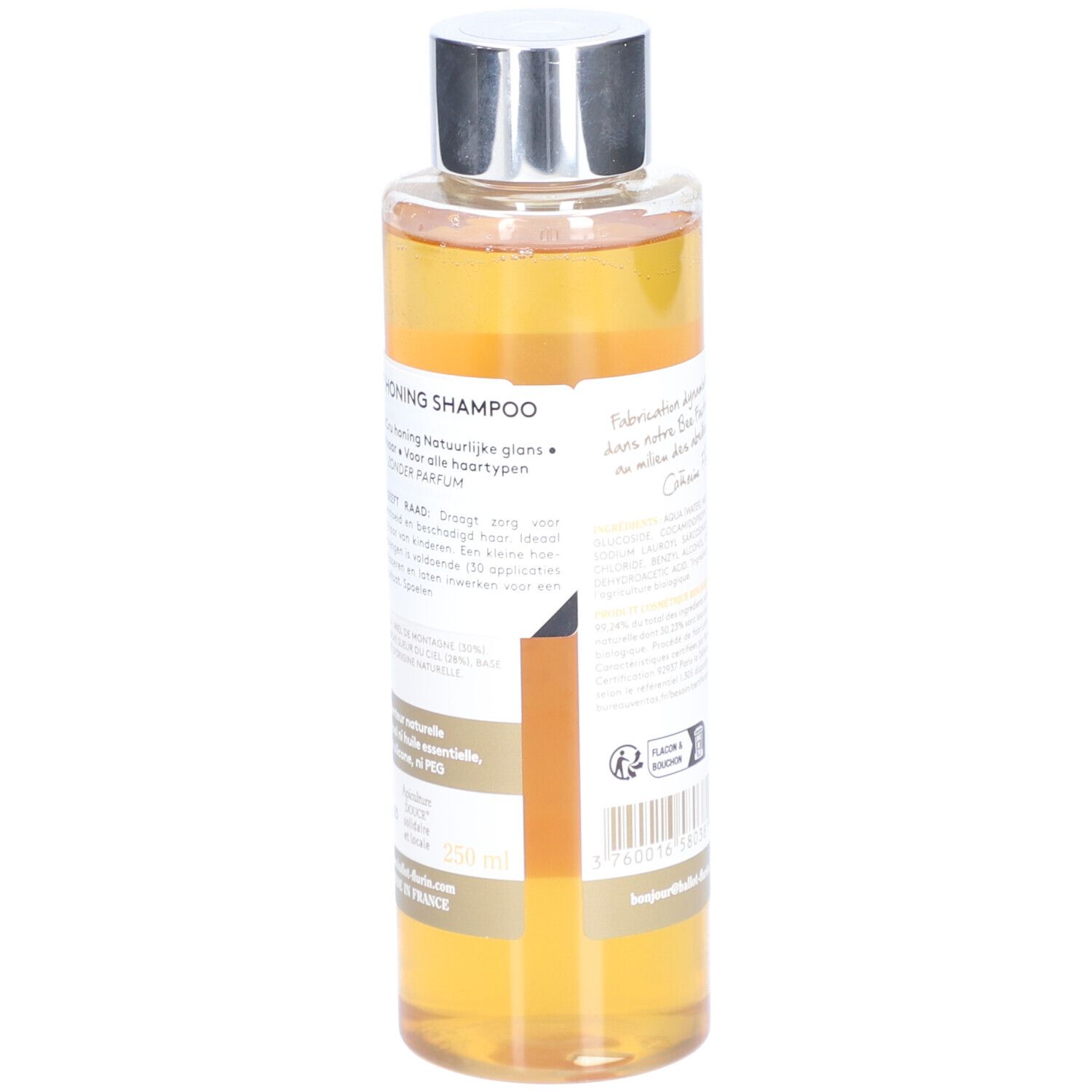 Rückseite der Shampoo-Flasche. Text mit Produktinformationen. Gelber Hintergrund. Herstellerlogo.