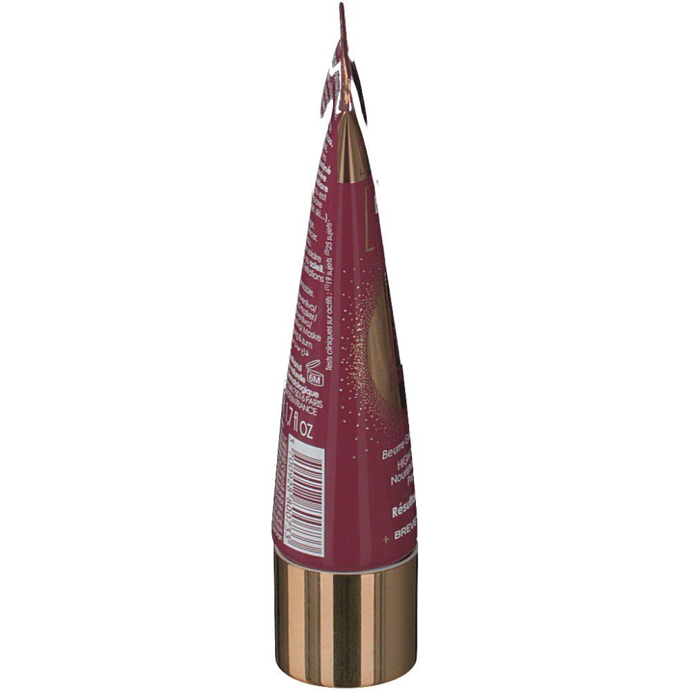 Seitenansicht des Produkttubes. Bordeauxfarbener Tube mit goldenem Verschluss. Produktname und Inhaltsstoffe sind aufgedruckt.
