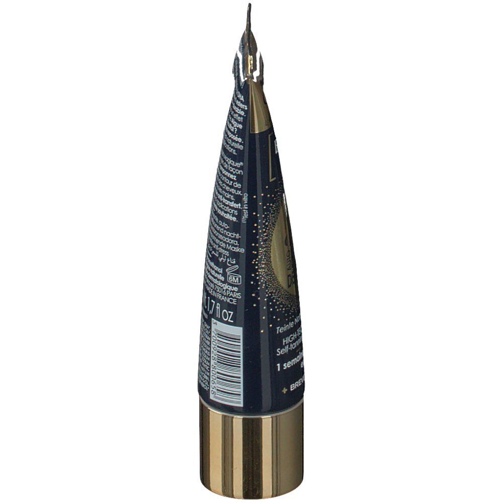 Seitenansicht des Tubus. Goldene Kappe und Verschluss. Blaue Verpackung mit Text. 50 ml.