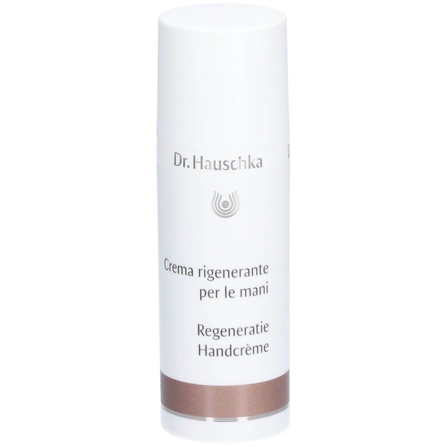 Tube blanc avec bouchon. Inscription: Dr. Hauschka, Crème pour les Mains Régénérante. Partie inférieure: marron.