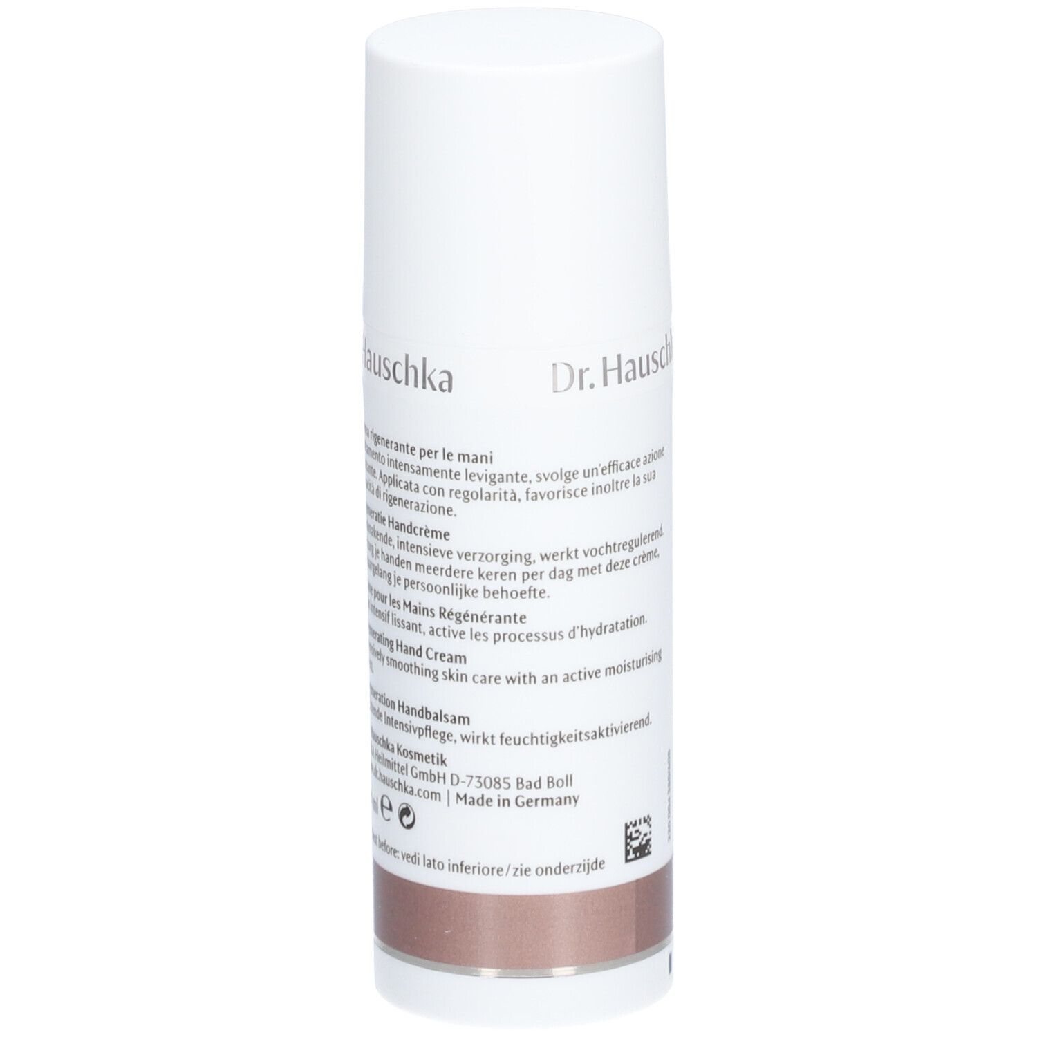 Tube blanc avec texte. Inscription: Dr. Hauschka, Crème pour les Mains Régénérante. Partie inférieure: marron.