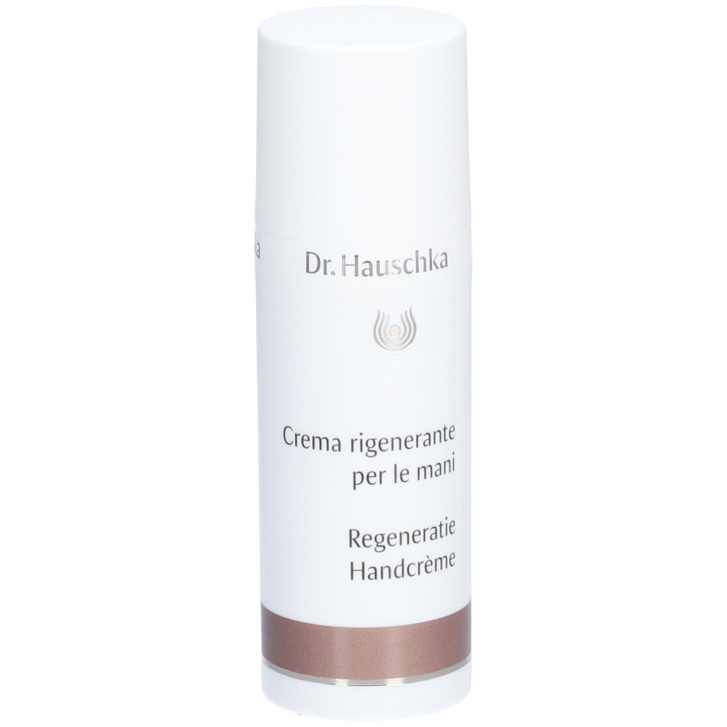 Tube blanc avec bouchon. Inscription: Dr. Hauschka, Crème pour les Mains Régénérante. Partie inférieure: marron.