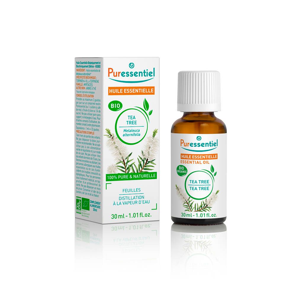 Bruine glazen fles met witte dop en etiket. Doos met productinformatie. Label: Puressentiel, Tea Tree.