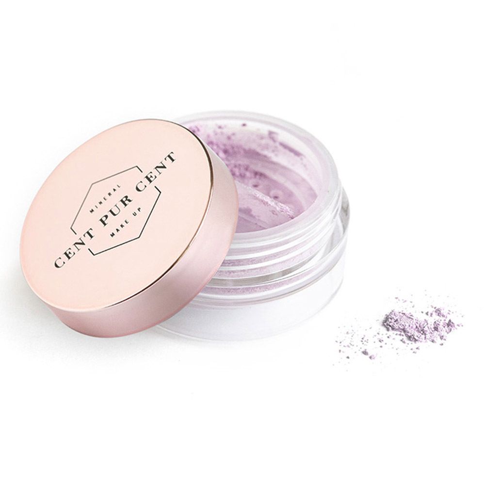 Pot ouvert de fard à paupières lâche lilas. Couvercle rose avec bord doré. Nom du produit visible.