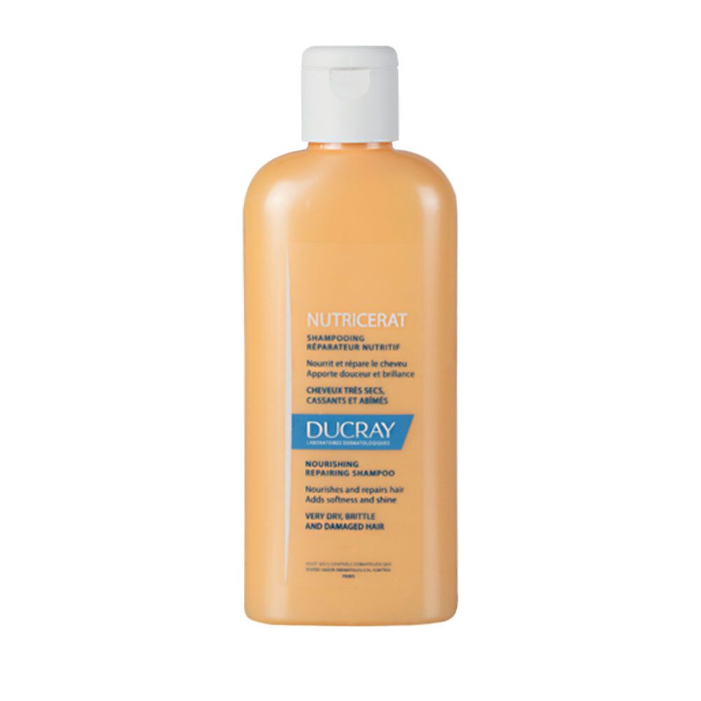 Shampoo jaune-orangé avec bouchon blanc. Inscription: NUTRICERAT, DUCRAY. Pour cheveux très secs, cassants et abîmés.