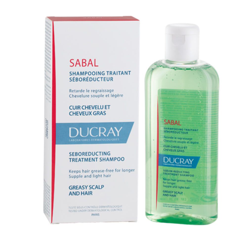 Produktverpackung mit Flasche. Karton mit SABAL, DUCRAY. Flasche grün, weißer Deckel. Text: Shampoo für fettiges Haar.